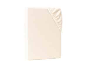 Spannbettlaken in Naturfarbe mit elastischem Rundumgummi, umgeschlagene Ecke sichtbar